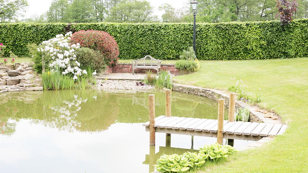 jetty, pebble beach and seating area